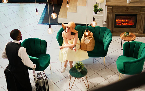Elegant hotel lobby with green chairs and sophisticated atmosphere