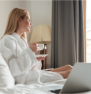 Modern affordable hotel room with professional woman